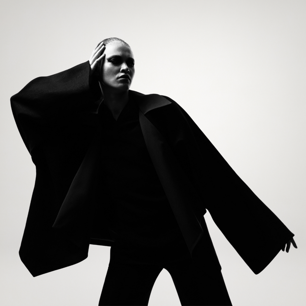 high fashion model in black designer suit