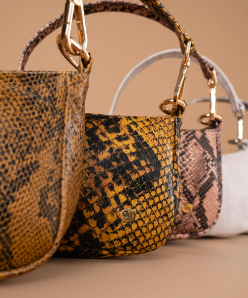 Designer bags Louis Vuitton, Yves Saint Laurent, Marc Jacobs, Prada, Fendi, and Gucci.
